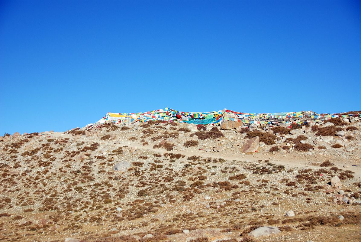 03 Below First Prostration Point Chaktsel Gang On Mount Kailash Outer Kora The first prostration point (Chaktsel Gang) looms above after walking just under an hour from Darchen (07:36).